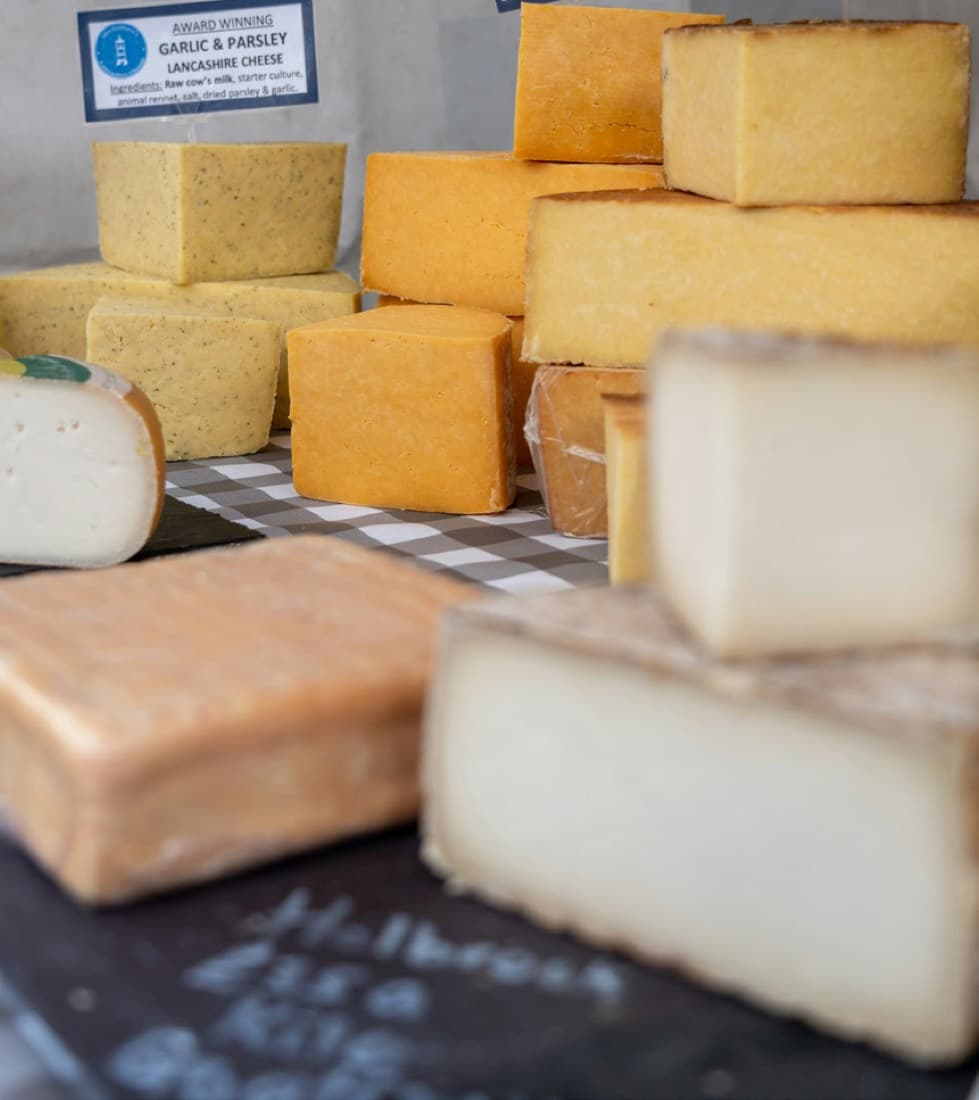 Assorted blocks of natural cheese on a counter